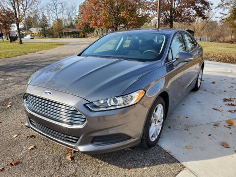 2014 Ford Fusion for sale at COOP'S AFFORDABLE AUTOS LLC in Otsego MI