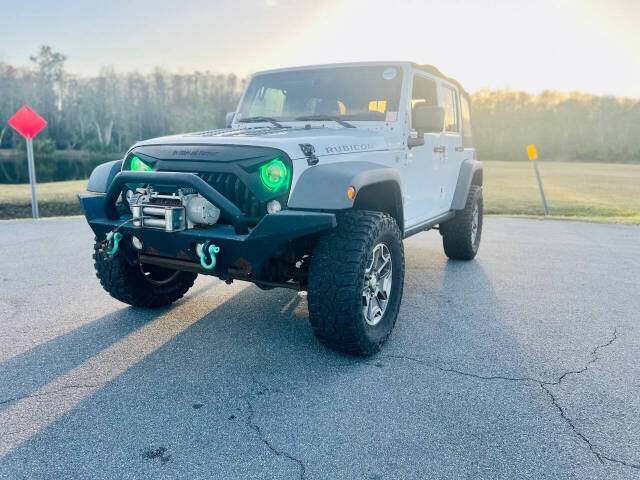 2014 Jeep Wrangler Unlimited for sale at Drive Masters Auto Sales in Orlando, FL