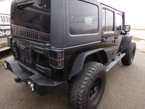 2011 Jeep Wrangler Unlimited for sale at English Autos in Grove City PA