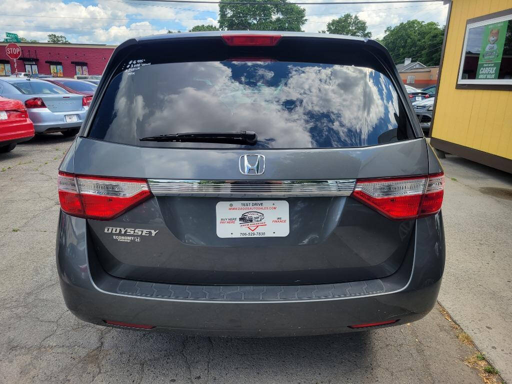 2012 Honda Odyssey for sale at DAGO'S AUTO SALES LLC in Dalton, GA