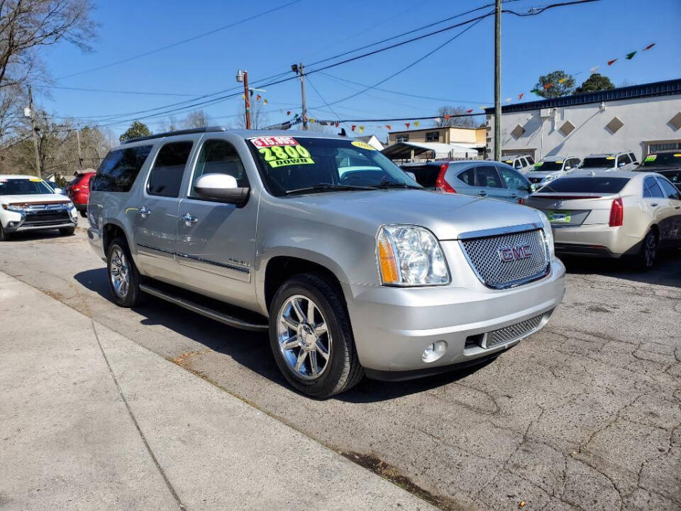 2011 GMC Yukon XL for sale at DAGO'S AUTO SALES LLC in Dalton, GA