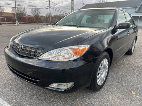 2003 Toyota Camry for sale at D'Ambroise Auto Sales in Lowell MA