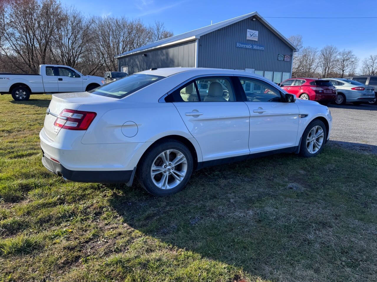 2013 Ford Taurus for sale at Riverside Motors in Glenfield, NY