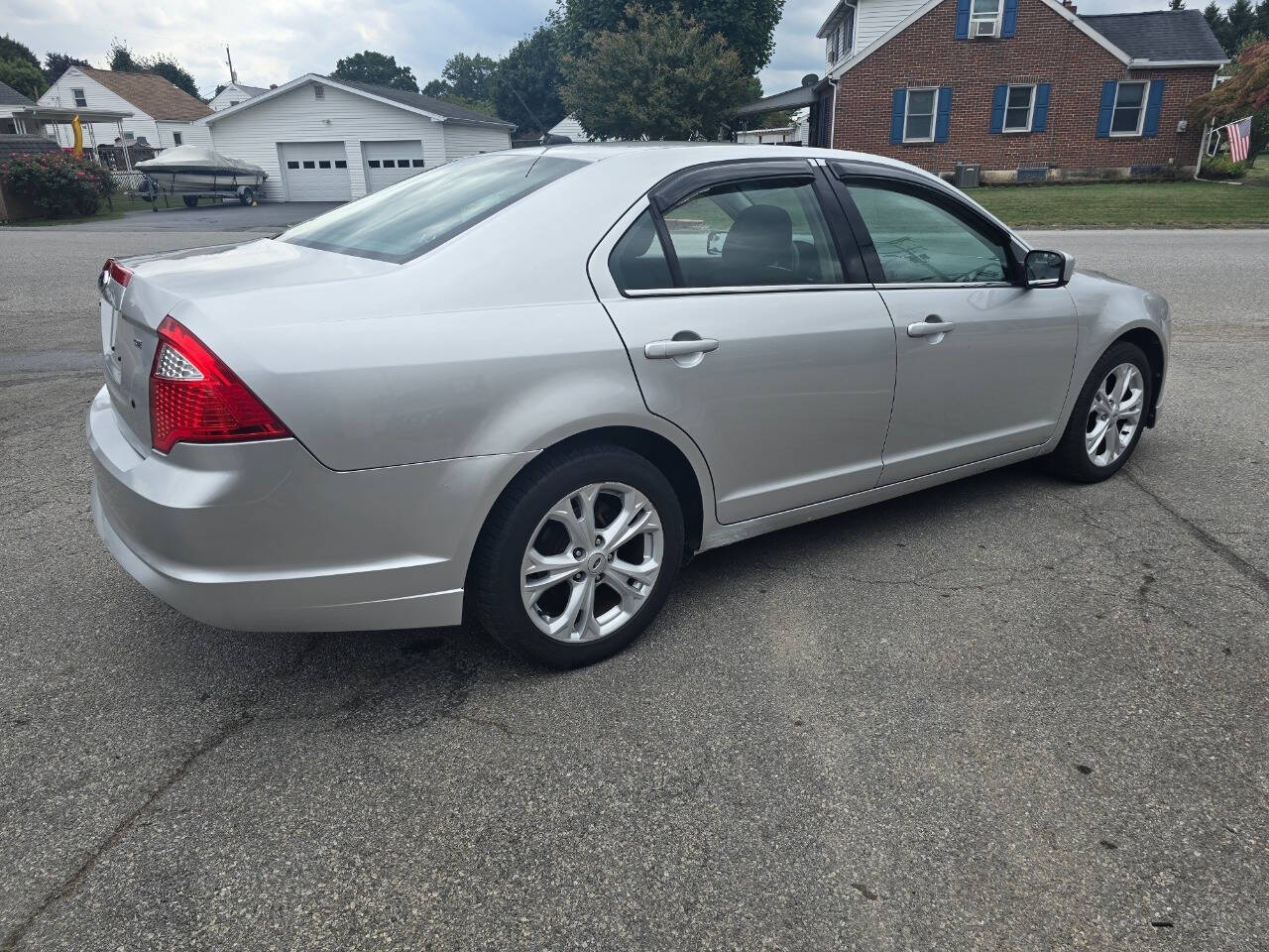 2012 Ford Fusion for sale at QUEENSGATE AUTO SALES in York, PA