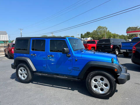 2015 Jeep Wrangler Unlimited for sale at CarTime in Rogers AR