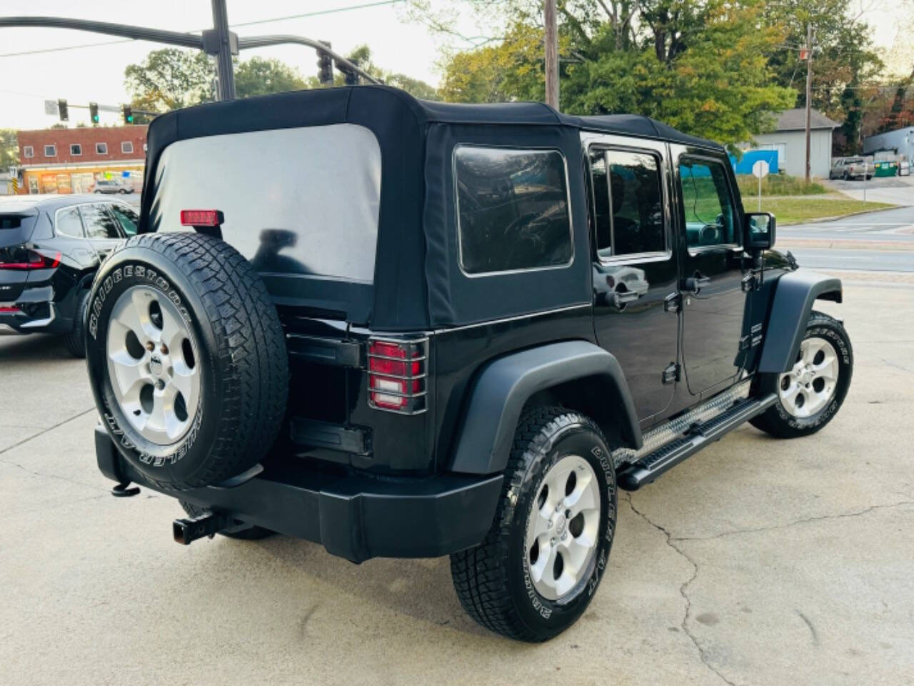 2012 Jeep Wrangler Unlimited for sale at AUTO LUX INC in Marietta, GA