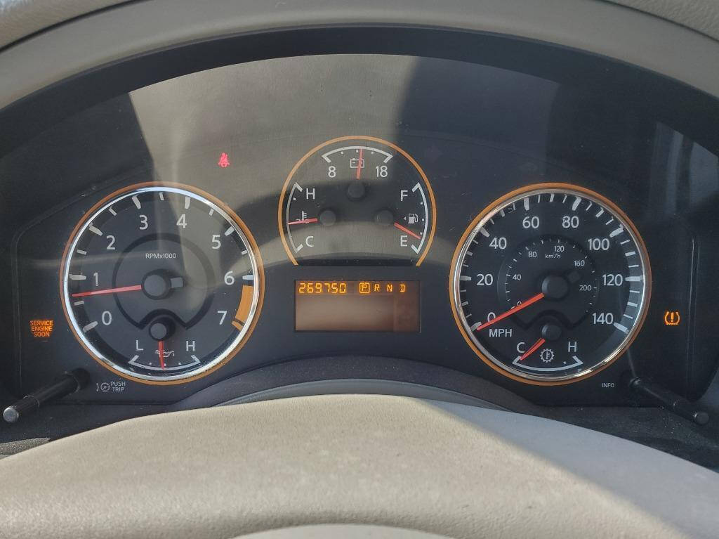 2010 Nissan Armada for sale at DAGO'S AUTO SALES LLC in Dalton, GA