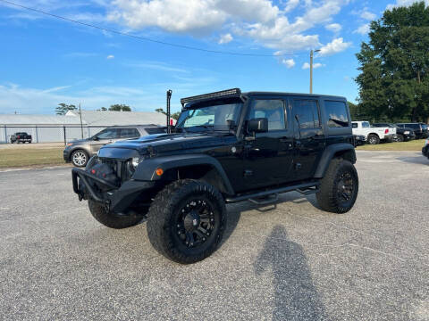 2015 Jeep Wrangler Unlimited for sale at Carworx LLC in Dunn NC