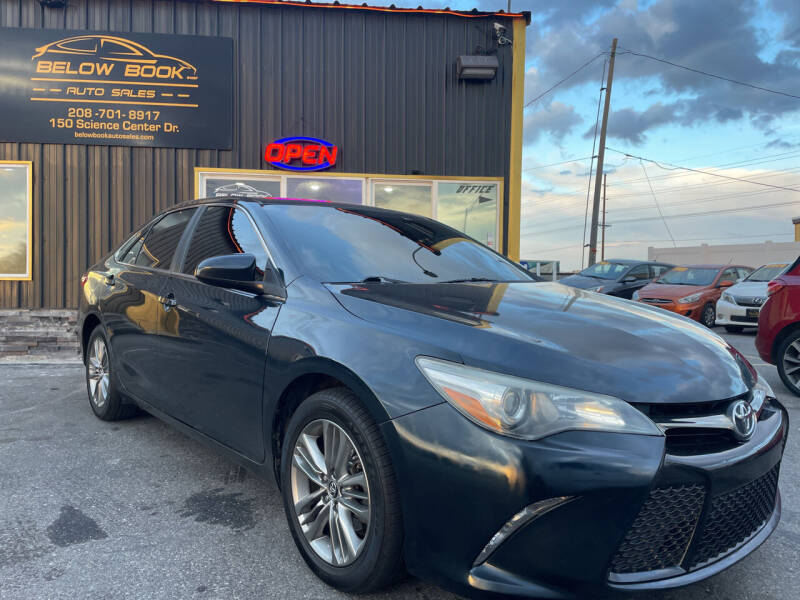 2016 Toyota Camry for sale at BELOW BOOK AUTO SALES in Idaho Falls ID