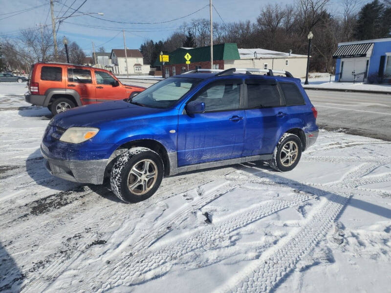 2005 Mitsubishi Outlander for sale at Maximum Auto Group II INC in Cortland OH