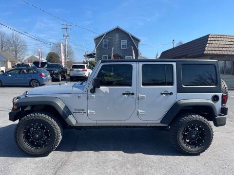 2011 Jeep Wrangler Unlimited for sale at MAGNUM MOTORS in Reedsville PA