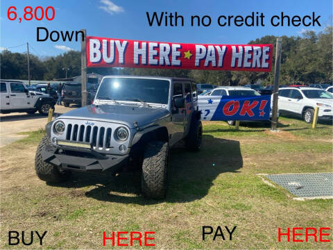 2015 Jeep Wrangler Unlimited for sale at First Choice Financial LLC in Semmes AL
