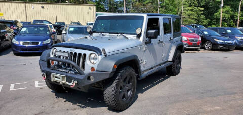 2012 Jeep Wrangler Unlimited for sale at GEORGIA AUTO DEALER LLC in Buford GA