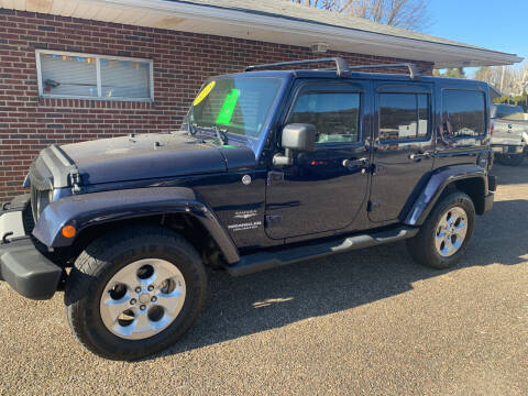 2013 Jeep Wrangler Unlimited for sale at MYERS PRE OWNED AUTOS & POWERSPORTS in Paden City WV
