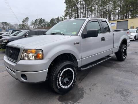 2006 Ford F-150 for sale at GEORGIA AUTO DEALER LLC in Buford GA