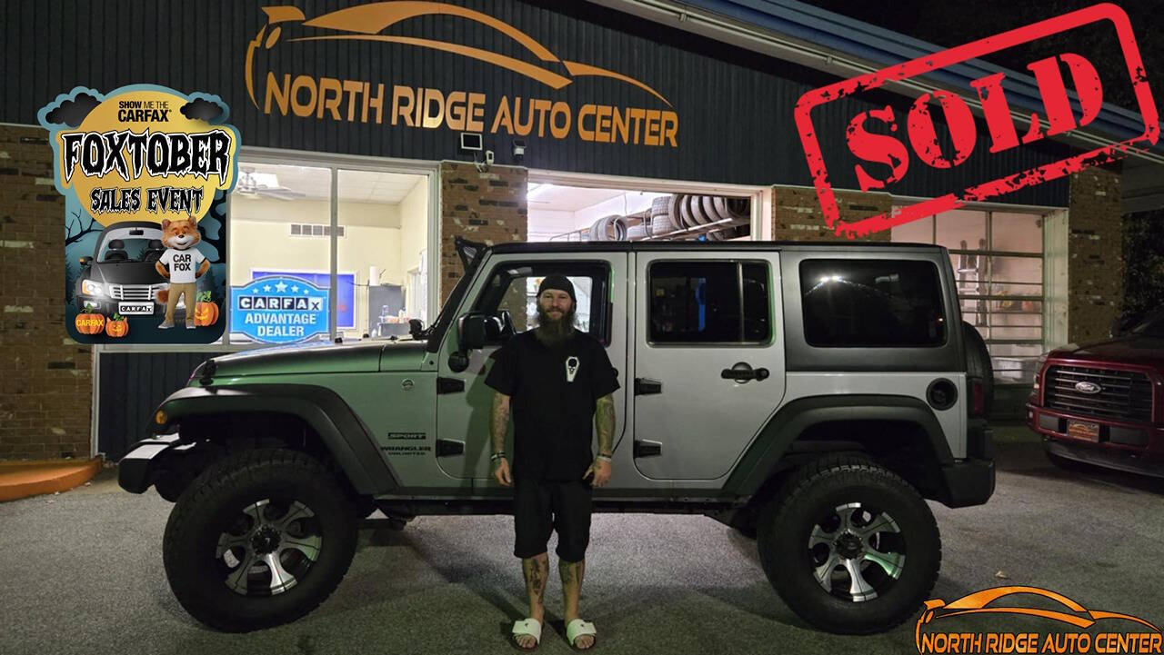 2014 Jeep Wrangler Unlimited for sale at North Ridge Auto Center LLC in Madison, OH