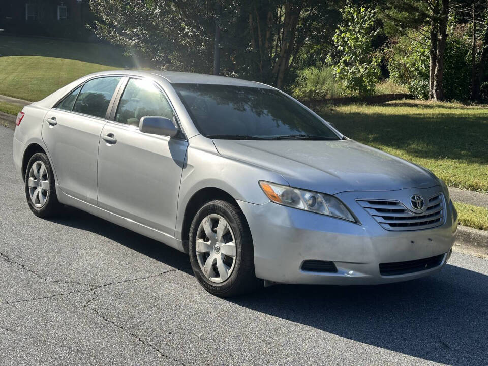 2009 Toyota Camry for sale at SHURE AUTO SALES in Snellville, GA