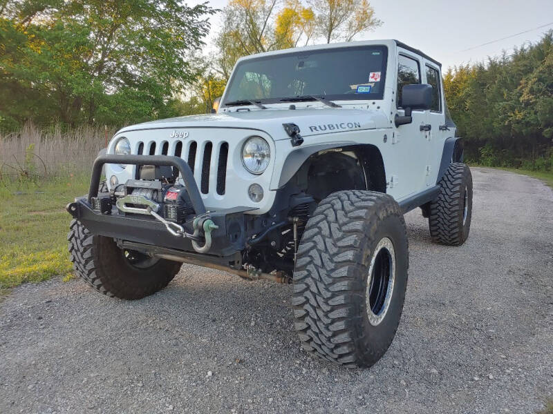 2014 Jeep Wrangler Unlimited for sale at The Car Shed in Burleson TX