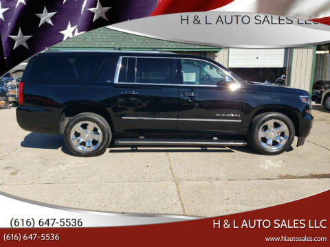 2015 Chevrolet Suburban for sale at H & L AUTO SALES LLC in Wyoming MI