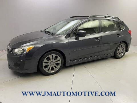 2014 Subaru Impreza for sale at J & M Automotive in Naugatuck CT