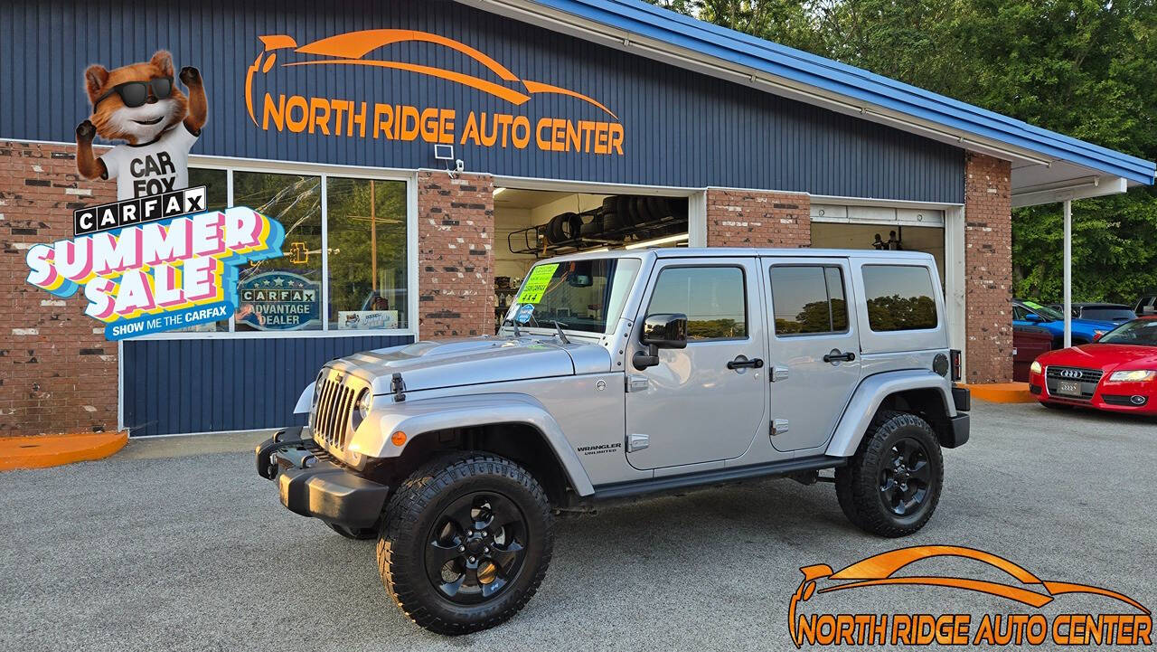 2015 Jeep Wrangler Unlimited for sale at North Ridge Auto Center LLC in Madison, OH