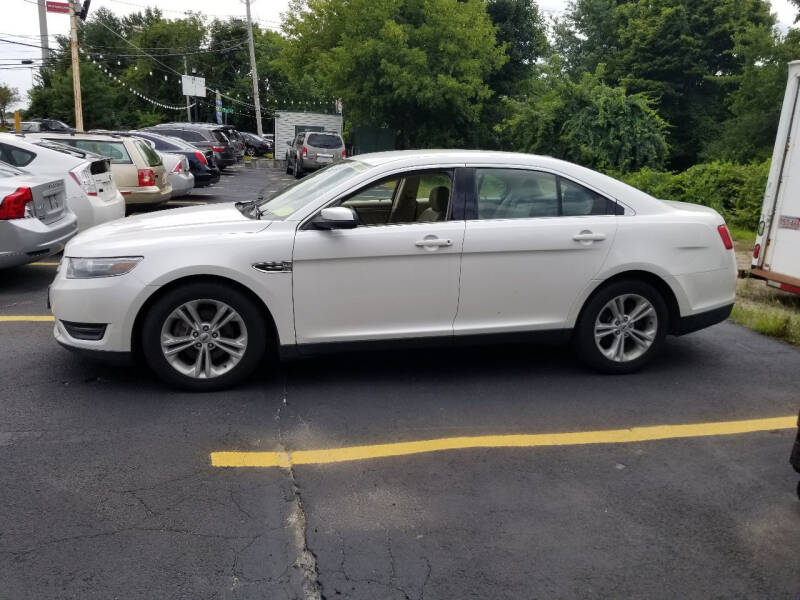 2013 Ford Taurus for sale at Howe's Auto Sales in Lowell MA