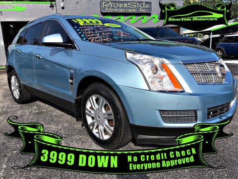 2011 Cadillac SRX for sale at RIVERSIDE MOTORCARS INC - Main Lot in New Smyrna Beach FL