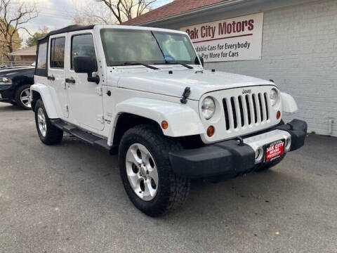 2013 Jeep Wrangler Unlimited for sale at Oak City Motors in Garner NC