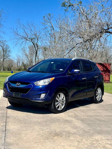 2011 Hyundai Tucson for sale at Vision Auto Group in Sugar Land TX