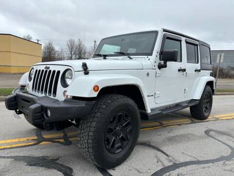 2016 Jeep Wrangler Unlimited for sale at Jim's Hometown Auto Sales LLC in Cambridge OH