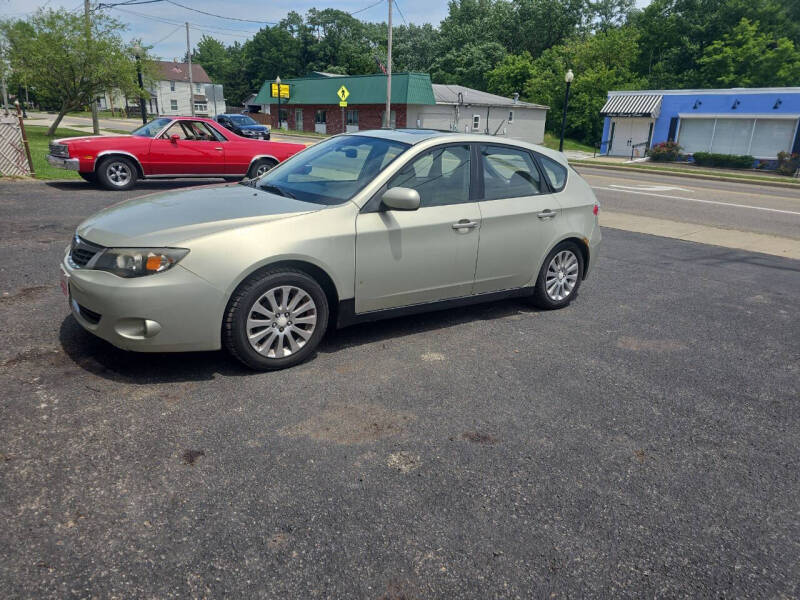 2009 Subaru Impreza for sale at Maximum Auto Group II INC in Cortland OH