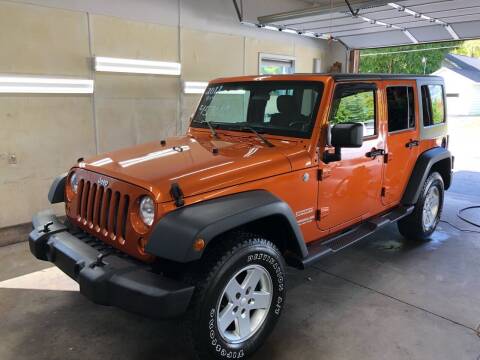 2011 Jeep Wrangler Unlimited for sale at MADDEN MOTORS INC in Peru IN