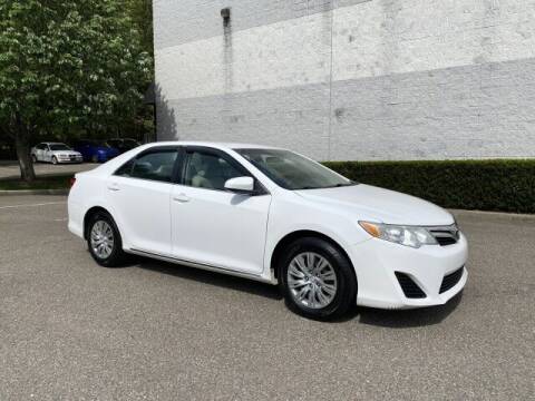 2014 Toyota Camry for sale at Select Auto in Smithtown NY
