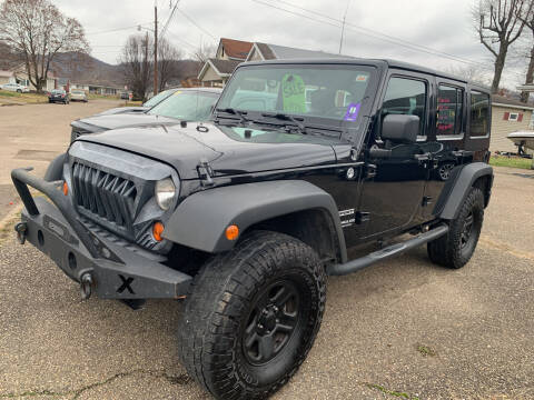 2013 Jeep Wrangler Unlimited for sale at MYERS PRE OWNED AUTOS & POWERSPORTS in Paden City WV