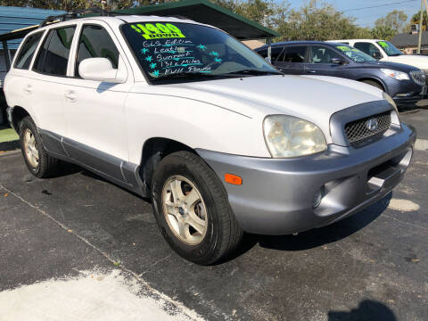 2004 Hyundai Santa Fe for sale at RIVERSIDE MOTORCARS INC - South Lot in New Smyrna Beach FL