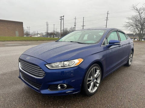 2014 Ford Fusion for sale at Minnix Auto Sales LLC in Cuyahoga Falls OH