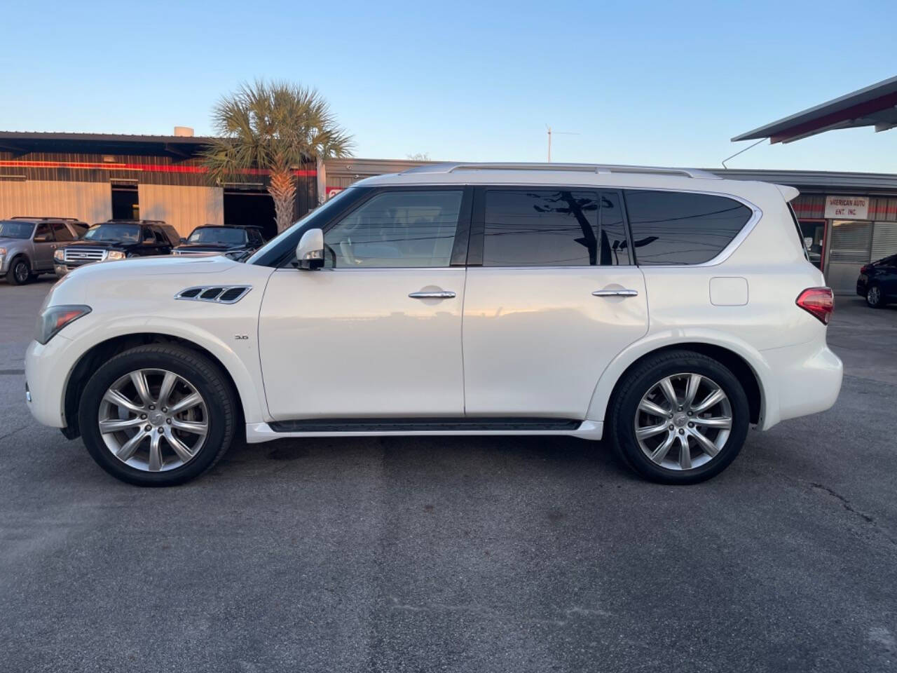 2014 INFINITI QX80 for sale at SMART CHOICE AUTO in Pasadena, TX