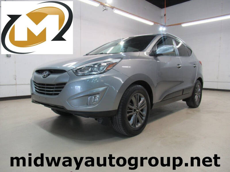 2015 Hyundai Tucson for sale at Midway Auto Group in Addison TX