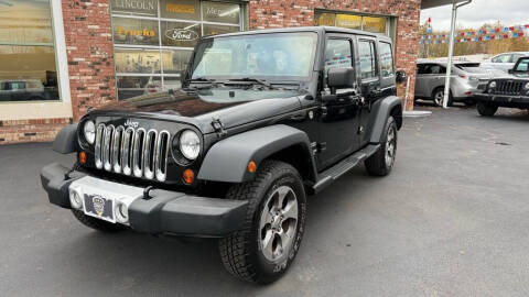 2012 Jeep Wrangler Unlimited for sale at Ohio Car Mart in Elyria OH