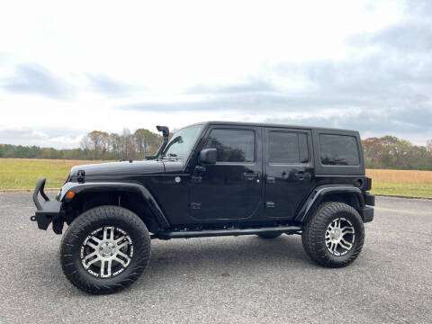 2011 Jeep Wrangler Unlimited for sale at LAMB MOTORS INC in Hamilton AL