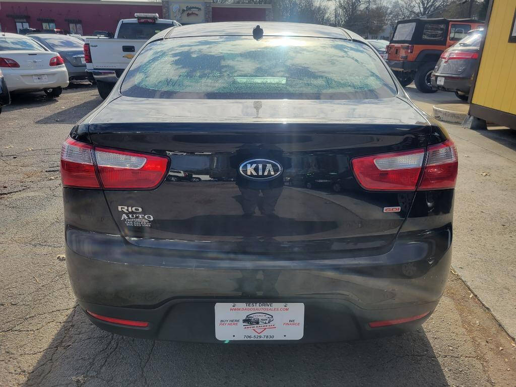 2015 Kia Rio for sale at DAGO'S AUTO SALES LLC in Dalton, GA