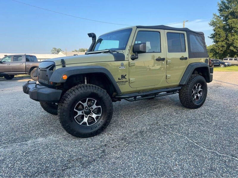 2013 Jeep Wrangler Unlimited for sale at Carworx LLC in Dunn NC