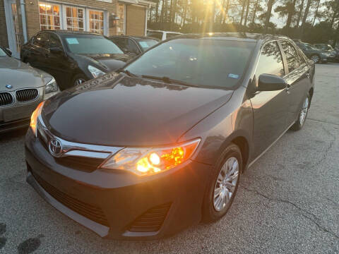 2012 Toyota Camry for sale at Philip Motors Inc in Snellville GA