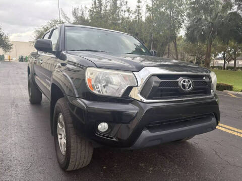 2015 Toyota Tacoma for sale at Rolling Cars LLC in West Park FL