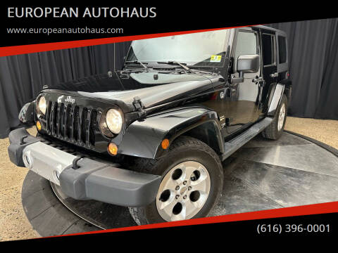 2015 Jeep Wrangler Unlimited for sale at EUROPEAN AUTOHAUS in Holland MI