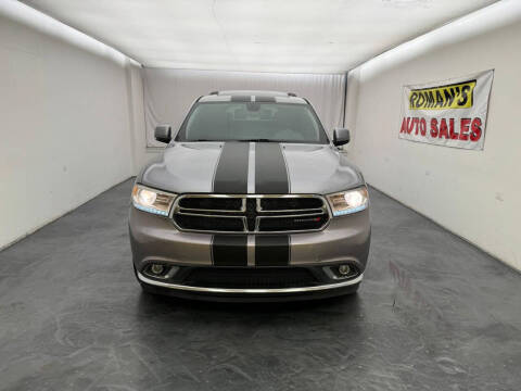 2014 Dodge Durango for sale at Roman's Auto Sales in Warren MI