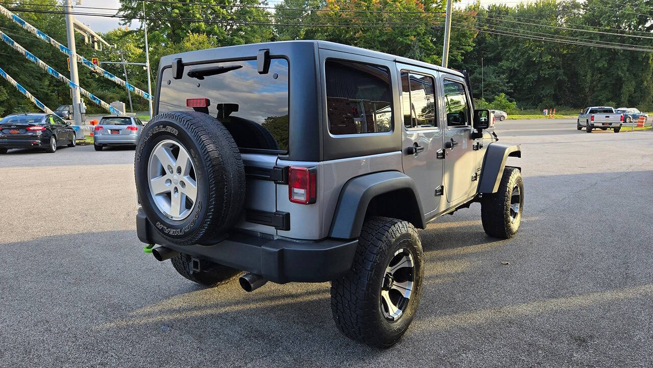 2014 Jeep Wrangler Unlimited for sale at North Ridge Auto Center LLC in Madison, OH