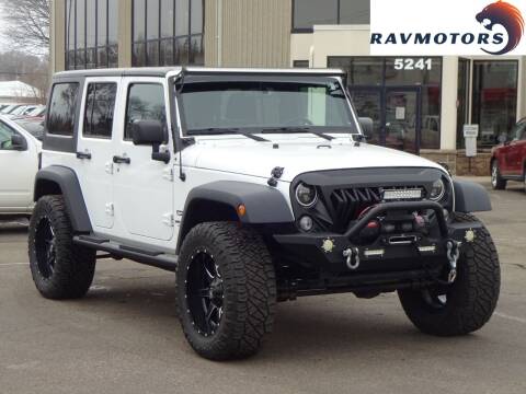 2016 Jeep Wrangler Unlimited for sale at RAVMOTORS 2 in Crystal MN