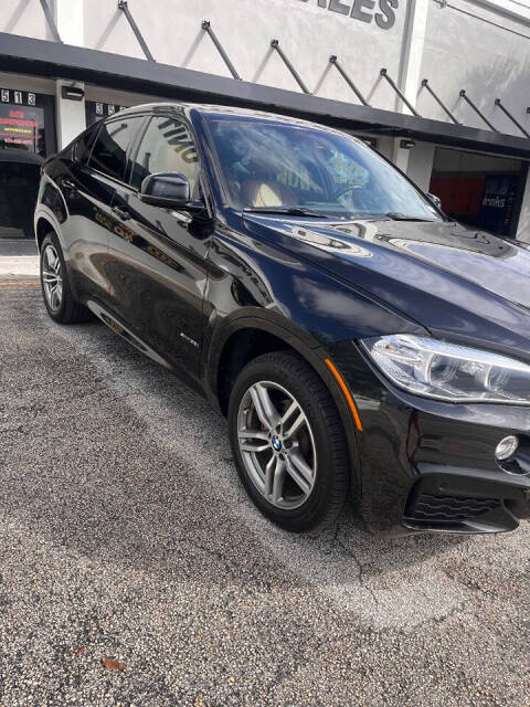 2019 BMW X6 for sale at M & J UNITED AUTO SALES in LAUDERDALE LAKES, FL