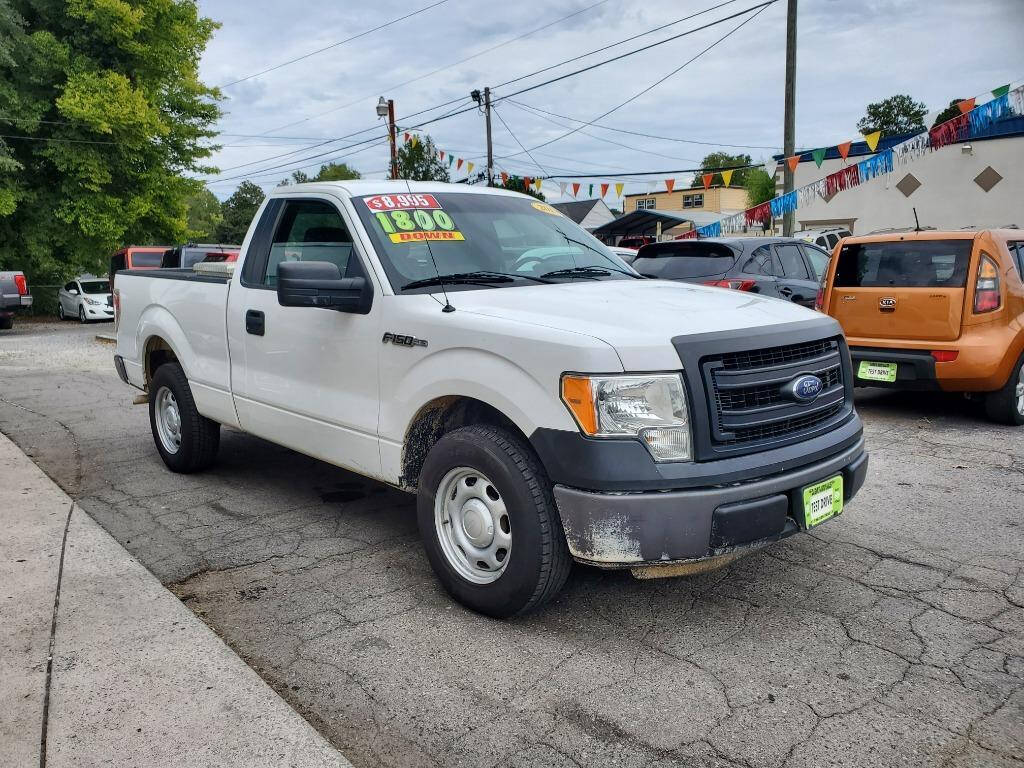 2013 Ford F-150 for sale at DAGO'S AUTO SALES LLC in Dalton, GA